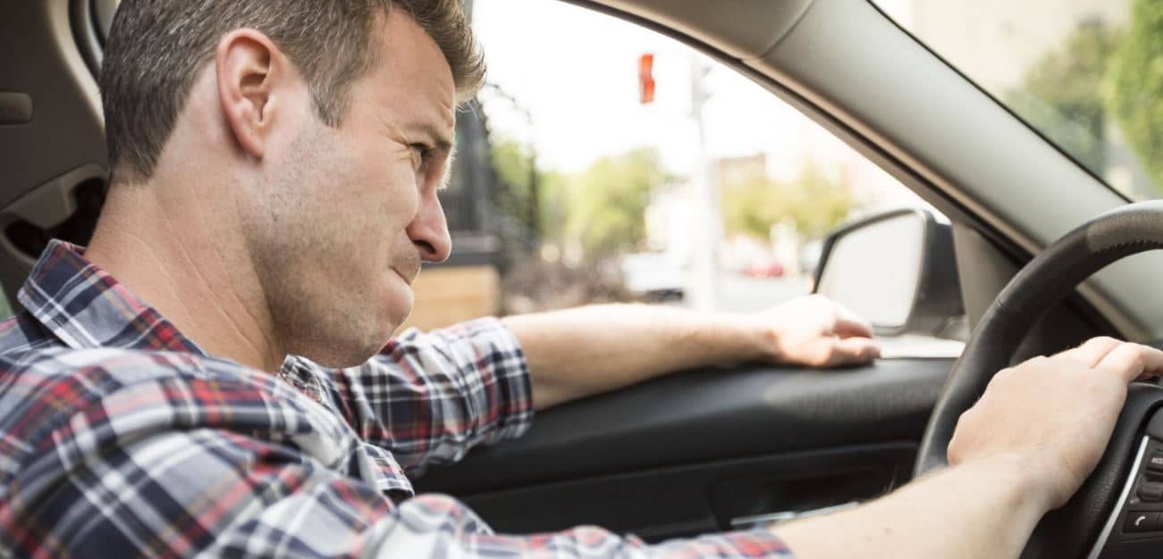 Driver shows his irritation feelings in a car