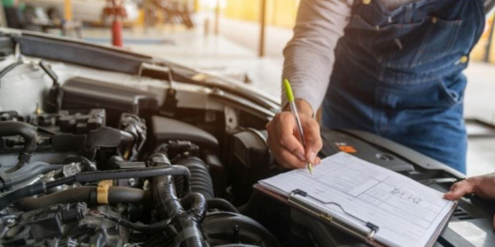 Mechanic checks his checklist 